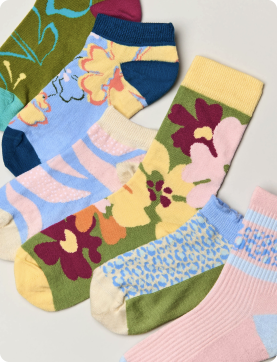 Colorful floral-patterned socks on a light background